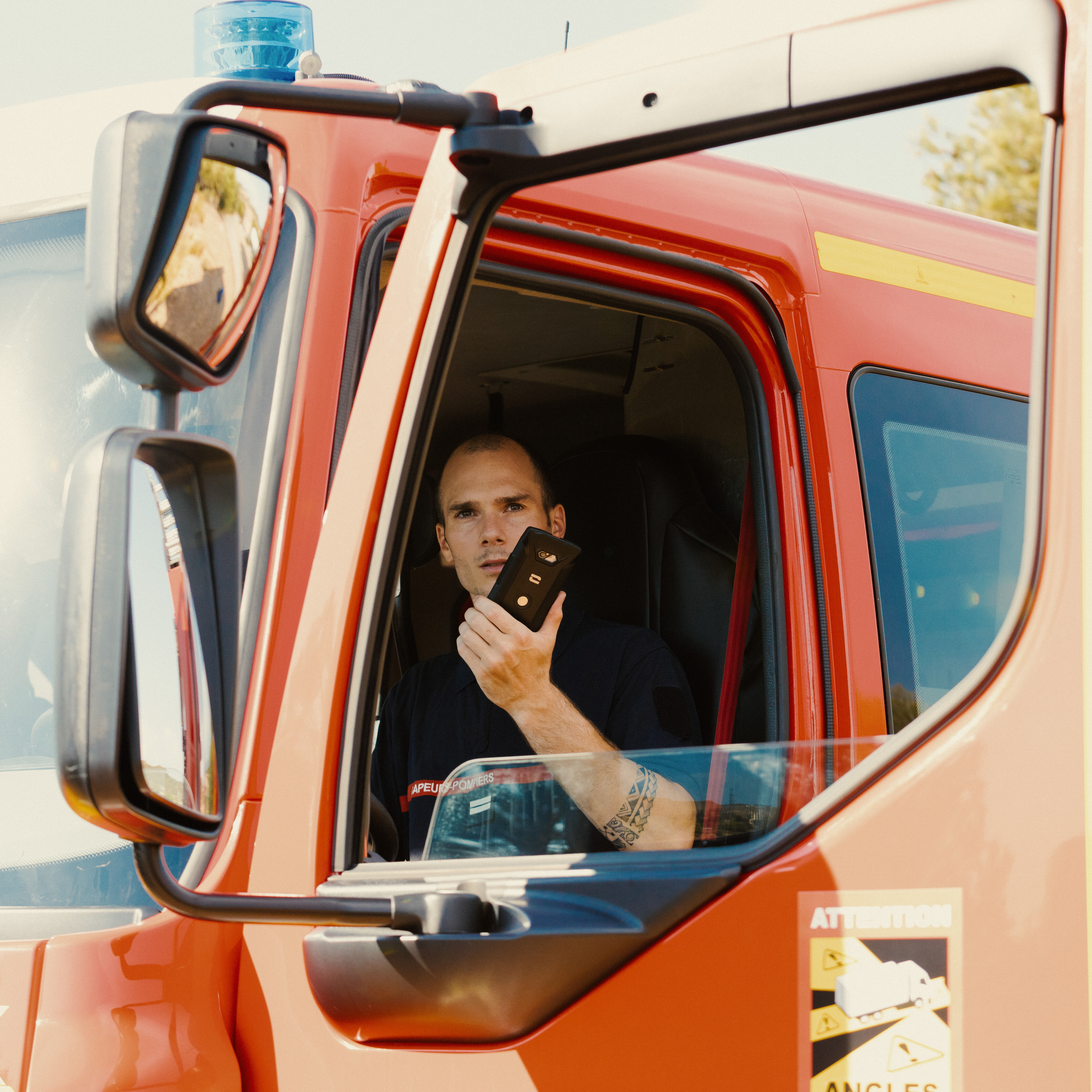 Firefighter with Crosscall smartphone during critical mission